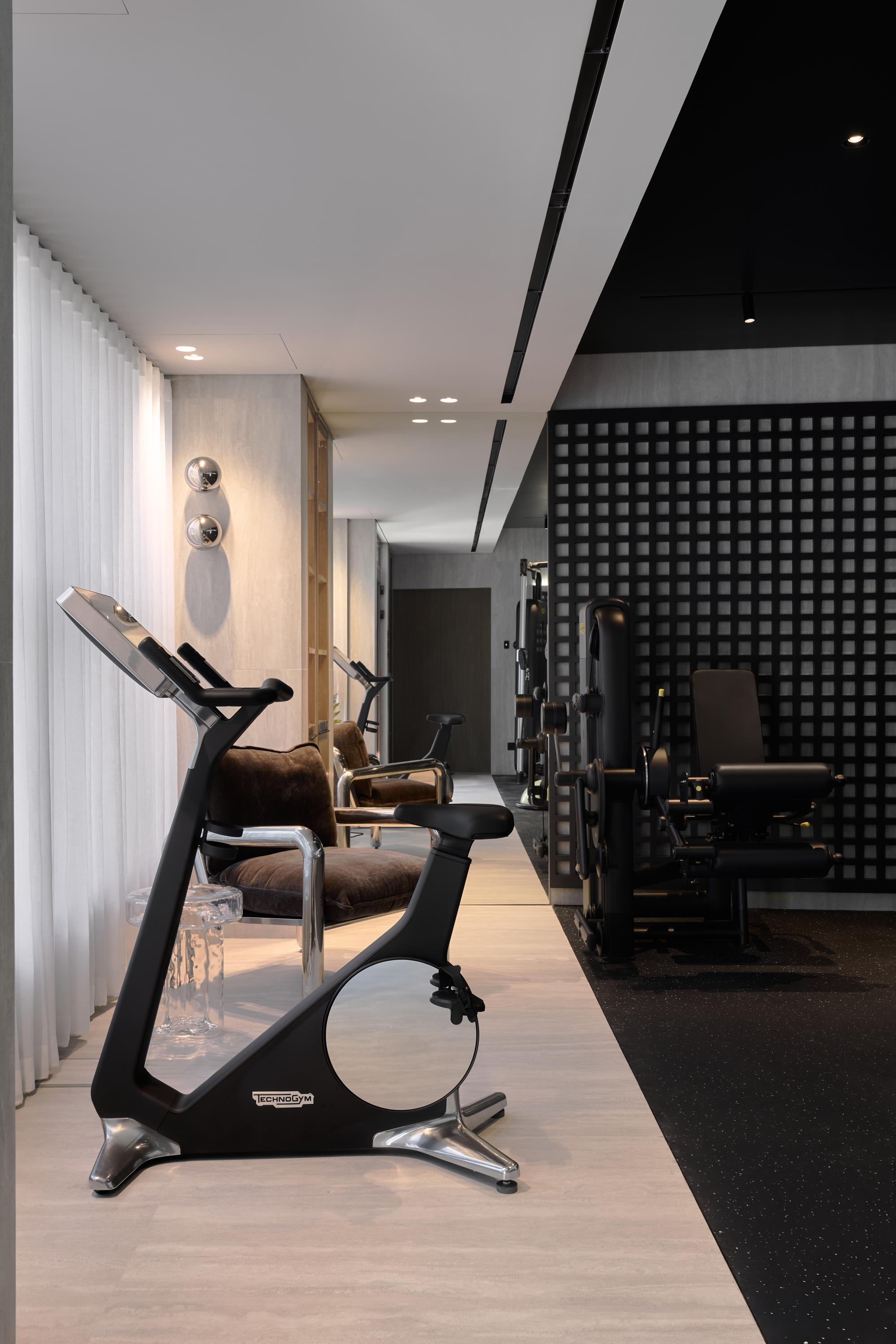 A private wellness gym behind sheer curtains
